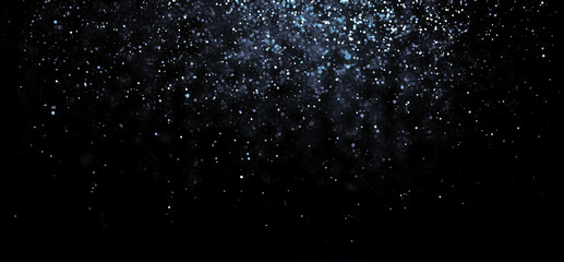 Small shinny particles falling down. Glitter texture abstract background.