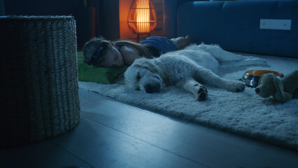 Girl lying on mild carpet with dog, sleeping together, feeling relaxed after saturated day,...