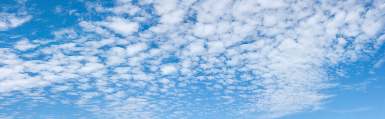 Large panorama of a real blue sky with white clouds in summer