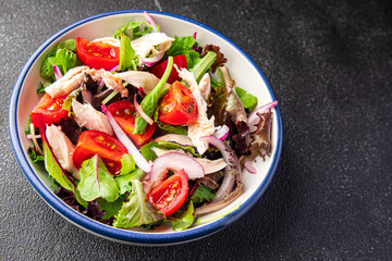 salad chicken breast, tomato, green lettuce, red onion healthy meal food snack diet on the table copy space food background rustic top view keto or paleo diet