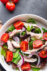 salad chicken breast, tomato, green lettuce, red onion healthy meal food snack diet on the table copy space food background rustic top view keto or paleo diet