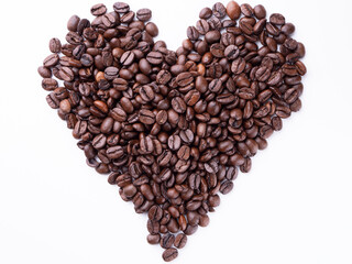 Roasted coffee beans in the shape of a heart