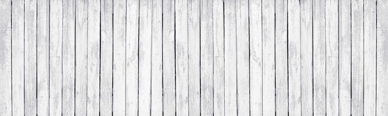 White painted old wooden rustic fence. Whitewashed rough wood board large texture. Light grunge background