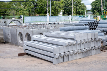 Precast concrete pillars, neatly arranged in a building material shop, prefabricated cement pillars