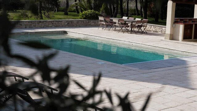 Revealing shot of a stunning crystal clear outdoor pool