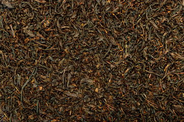 dry black tea leaves as background texture