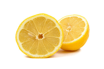 fresh lemon cut into two equal halves on insulated white background