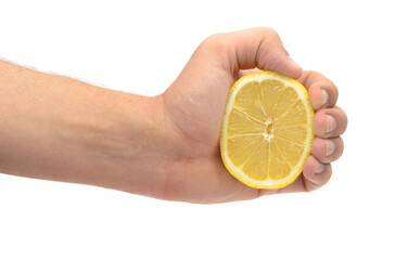 human hand squeezing lemon large pan on white background