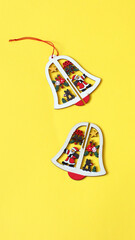 Christmas and New Year bell on yellow background