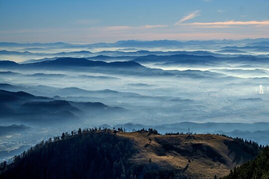 Aerial of cloudy mountain ranges in Krvavec, Slovenia