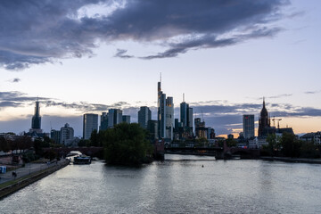 Sunset in the city of Frankfurt, seen from the Bubis bridge, view of the old part of the city and the financial and office area.