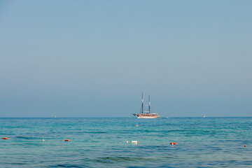 A cruise ship sailing on the sea. Travel by ferry. Sea cruise on a ship. Blue seascape with ship. Sea voyage