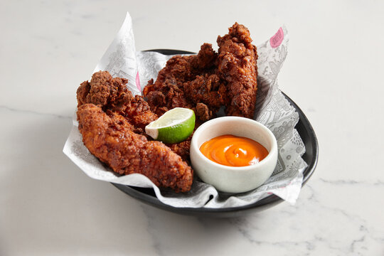 Fried chicken wings dish on table