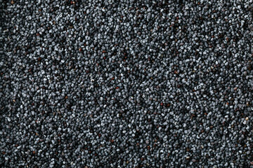 Poppy Seeds Background. Dark dry raw poppy seeds background. Abstract background