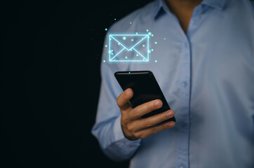 Businessman holding mail icon. Electronic mail concept, online communication on the internet network	
