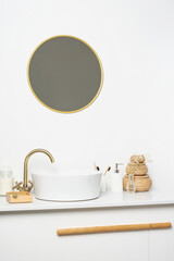 Bathroom marble counter with sink, candles and toothbrushes near white wall, copy space