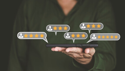 Customer service and Satisfaction concept Men's hands doing online assessments in the satisfaction rating the popular service company allows customers in order to improve and develop the organization