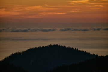 Sunset over the sea and hills