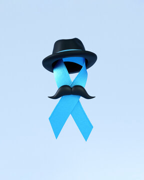 Blue ribbon with hat, moustache and copy space isolated on a blue background for Blue November and Prostate Cancer Awareness Month social media post or poster design