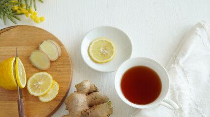 Ginger tea with sliced lemon.

