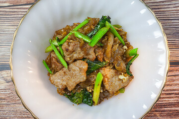 Stir fried rice noodles with soy sauce, Thai food Pad See Ew.