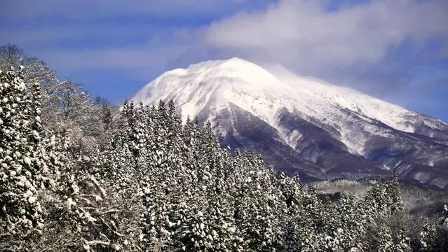 A big mountain covered with white snow in winter, Mt. Iwaki in Aomori Prefecture in Japan, Nature or travel background	