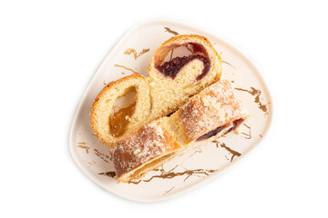 Homemade sweet bun with apricot jam isolated on white. top view.