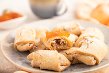Homemade sweet cookie with apple jam and cup of coffee on gray concrete. side view, selective focus.