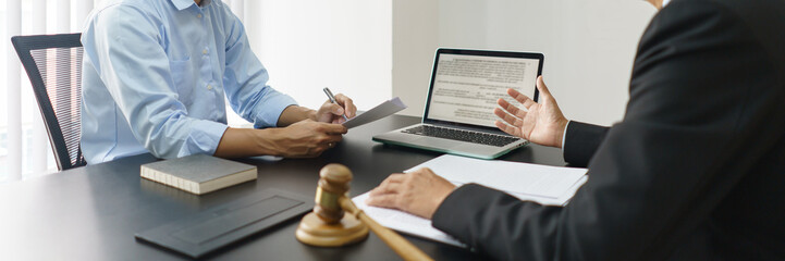 Lawyer and justice concept, Businessman takes notes as senior lawyer explain detail of the contract