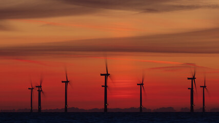 Off shore wind turbines at sunrise.