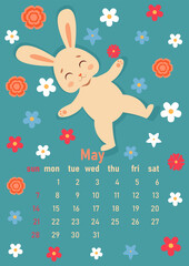 Calendar 2023 for May. Year of the rabbit, symbol of the new year. The week starts on Sunday. Cute rabbit smiles and lies on a spring meadow with flowers