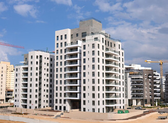 City construction among desert dunes. Building yard of Housing construction of houses in  new area of the city Holon in Israel