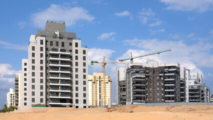 City construction among desert dunes. Building yard of Housing construction of houses in new area of the city Holon in Israel