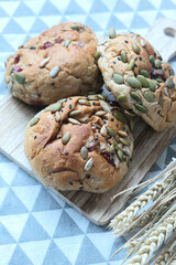sunflower seed and cranberry baked bread on a wooden board 