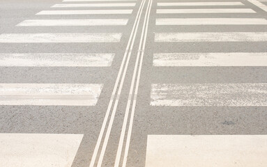 Crosswalk on the road for safety when people walking cross the street. 