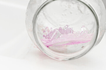 Chemical experiment on growing crystals. Crystal grown in a jar.