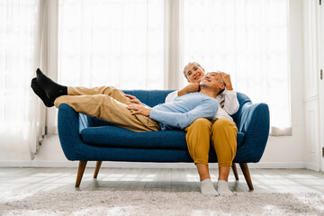 Elderly man and woman in living room together with Happy, Comfortable and Relationship lifestyle....