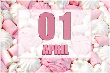 calendar date on the background of white and pink marshmallows. April 1 - the first day of the month