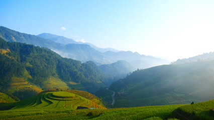 Beautiful Mountain landscape foggy windy mountain range green landscape asian farm. Amazing Landscape mountain green field meadow white cloud blue sky on sunrise. Countryside sunlight heaven scenery