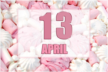 calendar date on the background of white and pink marshmallows. April 13 is the thirteenth day of the month