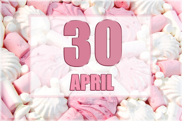 calendar date on the background of white and pink marshmallows. April 30 is the thirtieth day of the month