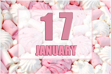 calendar date on the background of white and pink marshmallows.  January 17 is the seventeenth day of the month