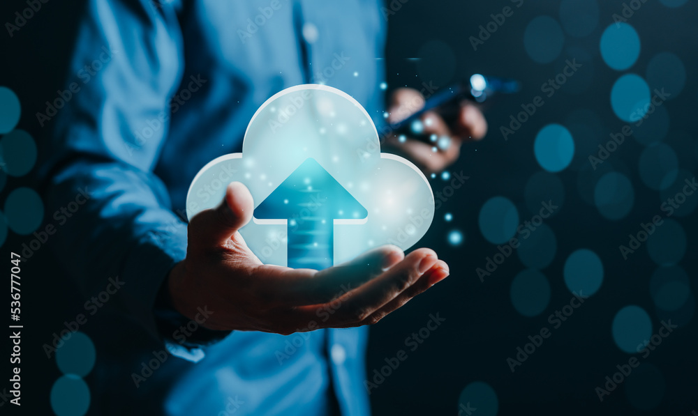 Fototapete Businessman holding virtual glowing cloud computing to download and loading data information and upload on system network application. Technology transformation concept