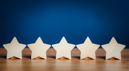 Wooden stars shape five stars rating service concept. satisfaction evaluation survey and review.