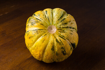 Blewah, Cantaloupe or Cucumis melo, a type of melon found in Indonesia, with a wooden background, cantaloupe is often used to make drinks during the fasting month of Ramadan