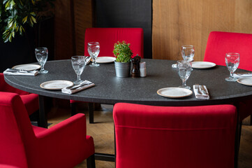 Served tables at beautiful interior of cafe or restaurant