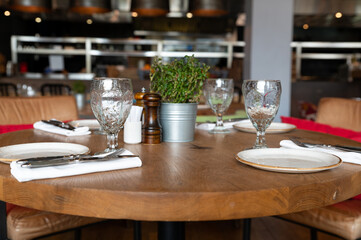 Served tables at beautiful interior of cafe or restaurant