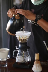 Barista brewing coffee