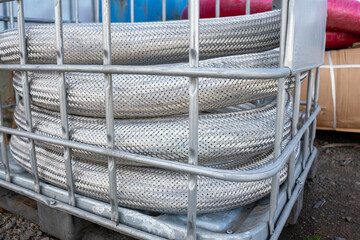 stainless hose twisted on a pallet	