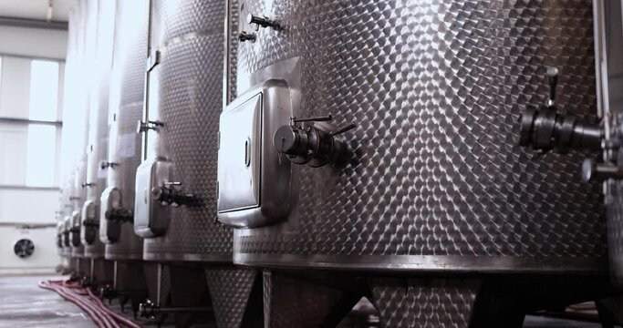 Wine production uses high volume stainless steel fermenters